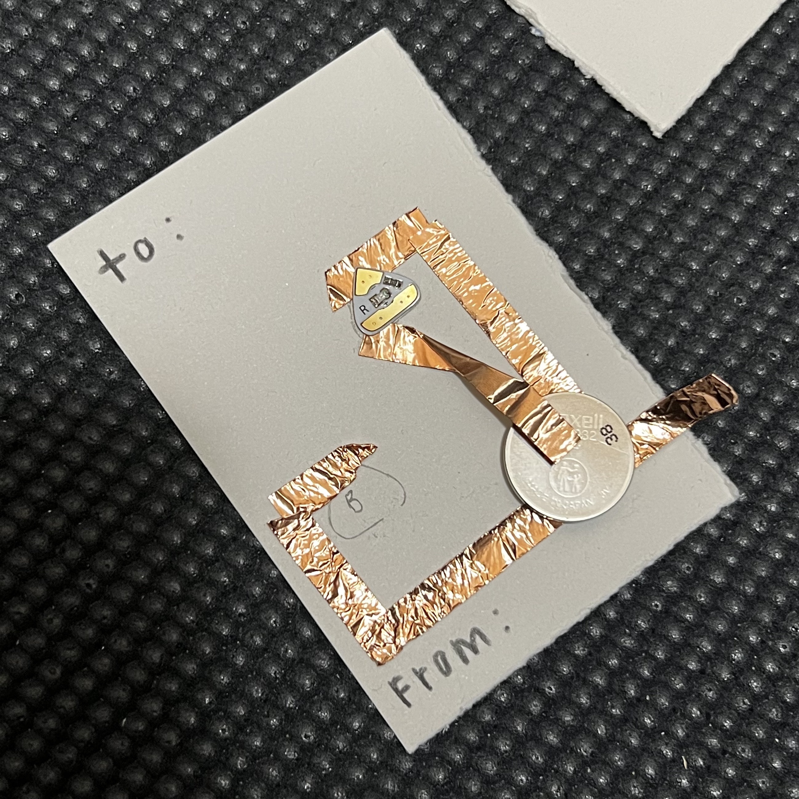 Circuit made on another holiday card with the same dimensions. Copper tape was not being conductive on this material