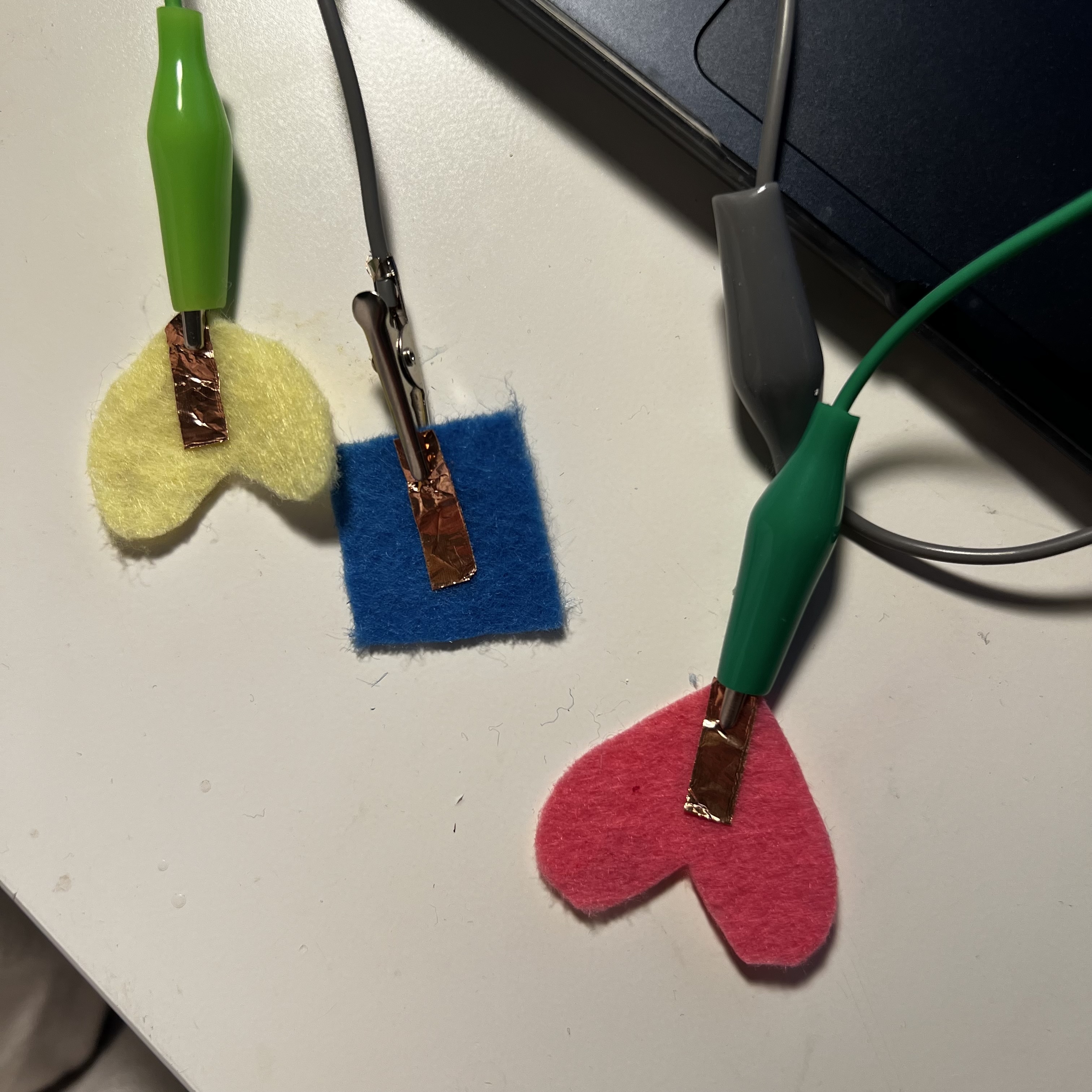 Buttons made with felt and made conductive with copper tape