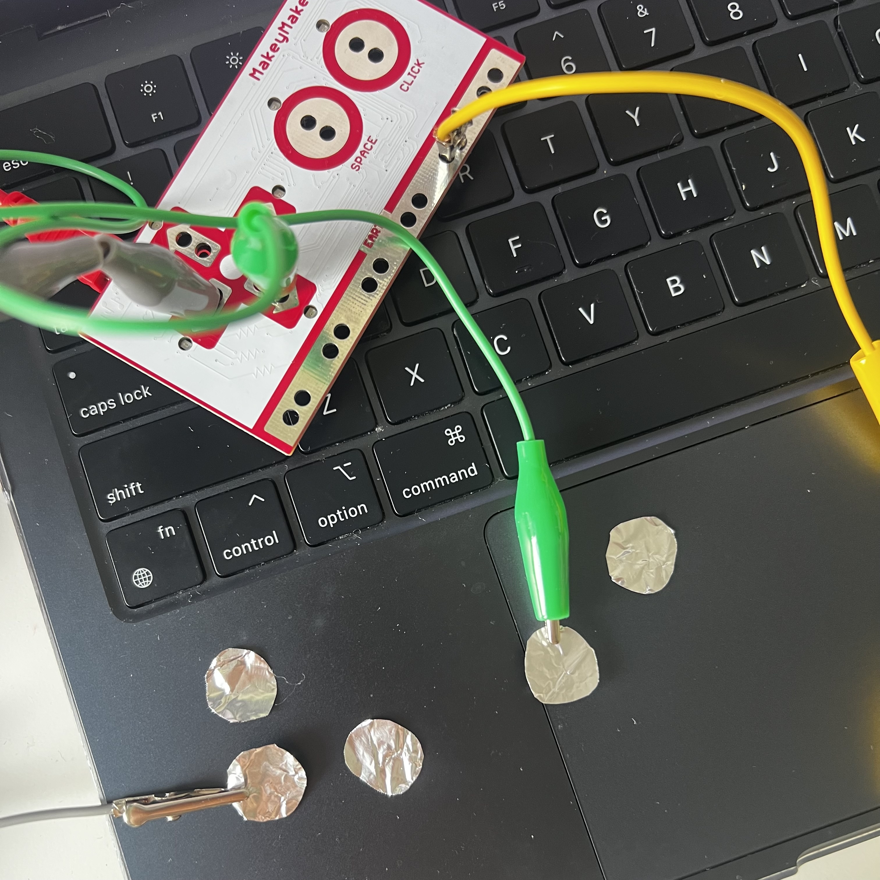 Tinfoil cut into circles to act as buttons