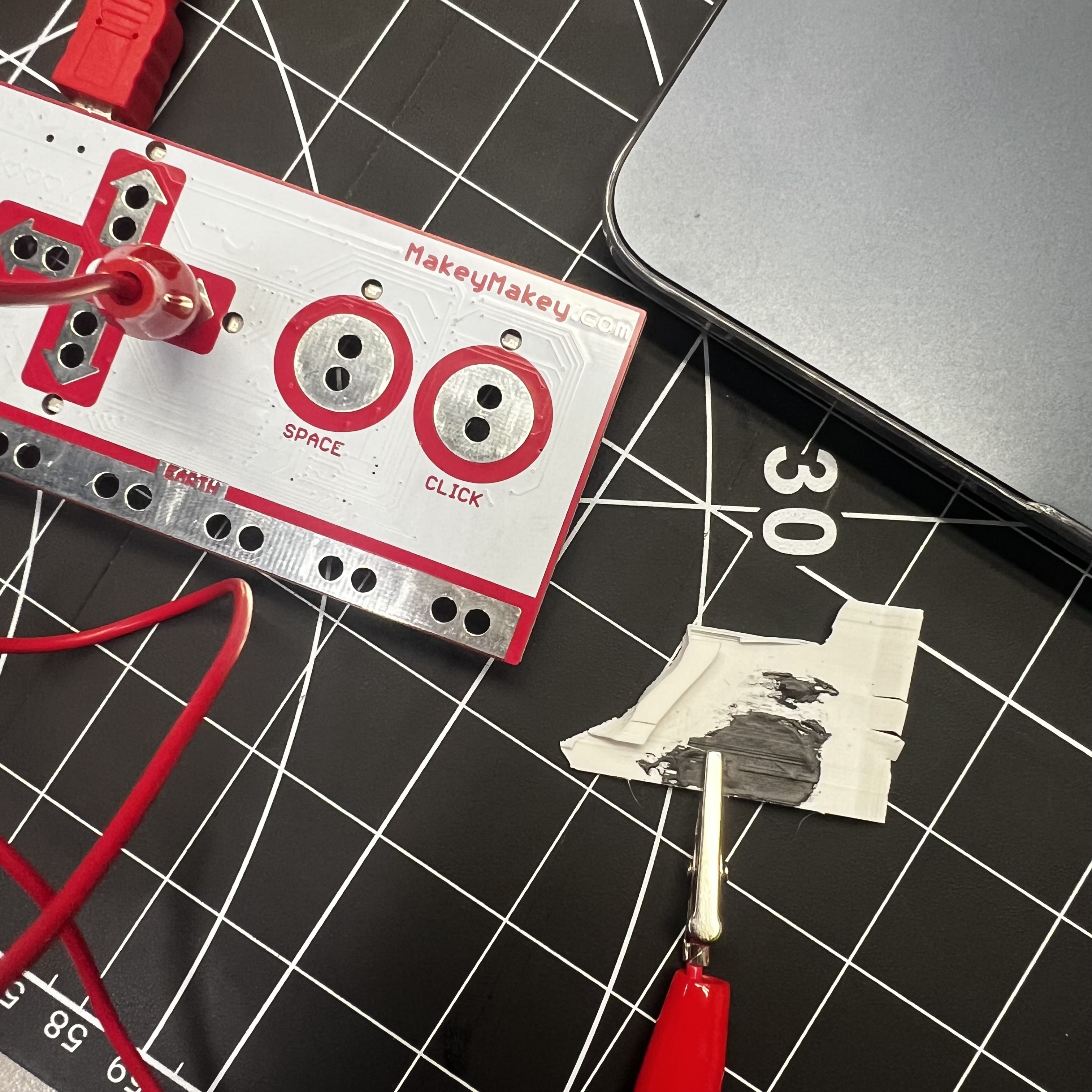 Using conductive paint as a connector to Makey Makey to control arrow keys